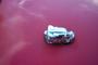 1993 Ford Probe - Toy car on a red surface.