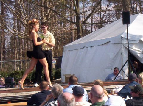 1986 Ford Bronco - An outdoor event with a tent, stage, and audience is captured in this scene.