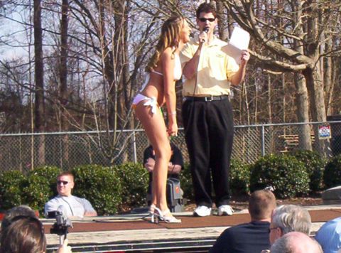1986 Ford Bronco - A bikini contest is underway with a host addressing the contestant on stage.