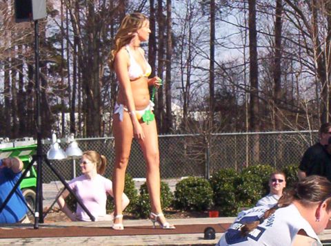1986 Ford Bronco - A woman participates in a bikini contest outdoors.