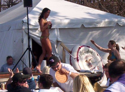 1986 Ford Bronco - An outdoor event with a bikini contest taking place on a stage, with spectators watching from below.