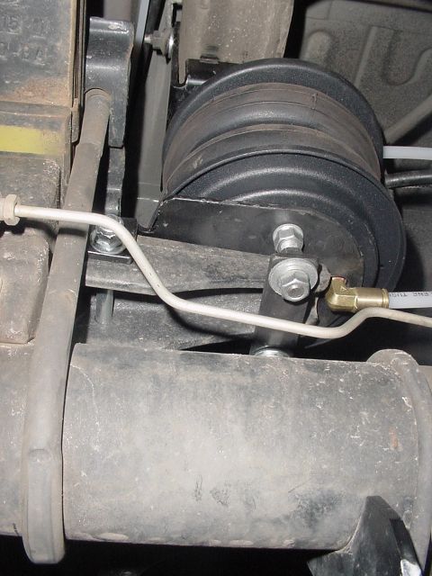 2002 Ford Excursion - Air spring bag installed on the rear axle of a vehicle.