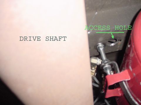 2002 Ford Excursion - This is the single stud that mounts the tank, an access hole was drilled to allow you to get the upper nut and washer in place