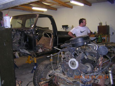 1986 Chevrolet Blazer - A disassembled 1986 Chevrolet Blazer sits in a garage, with the engine and front clip removed from the chassis.