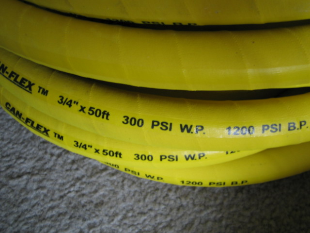 Yellow hose marked CAN-FLEX, 3/4" x 50ft, 300 PSI W.P., 1200 PSI B.P