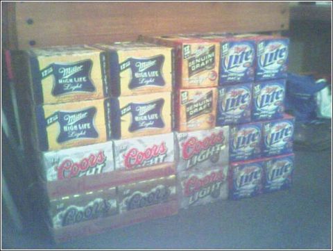 1993 Ford Bronco - A collection of beer cases including Miller High Life, Coors Light, and Genuine Draft is displayed.
