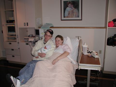 1998 Jeep TJ - A family celebrates the arrival of their newborn in a hospital room.