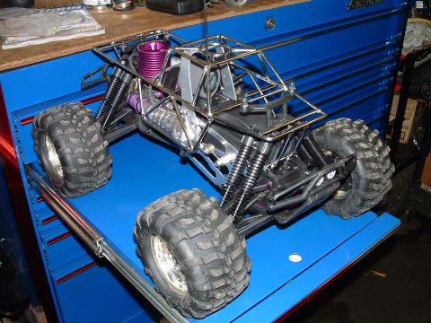 1994 Ford Bronco - This remote control monster truck is on display on a blue surface, possibly a tool chest drawer.