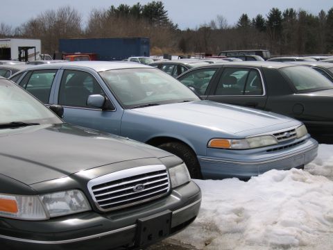 1991 Ford Crown Victoria LTD - Light blue Ford Crown Victoria parked in a lot with snow on the ground, showing its front quarter.