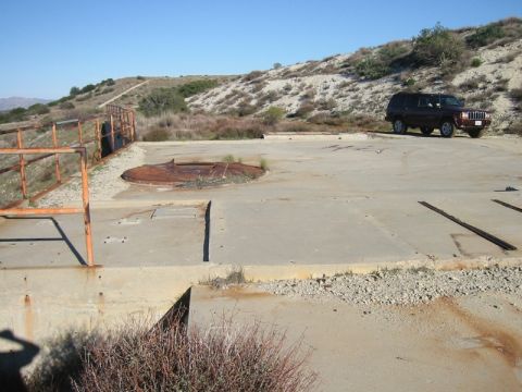 2000 Jeep Cherokee - The rusty manhole in the foreground is a launch tube, AKA silo. The Jeep's in the background for scale.