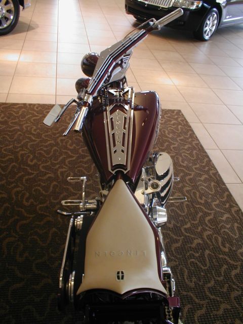 1979 Ford Bronco - A custom motorcycle with prominent Lincoln branding on its seat and fuel tank is displayed indoors.