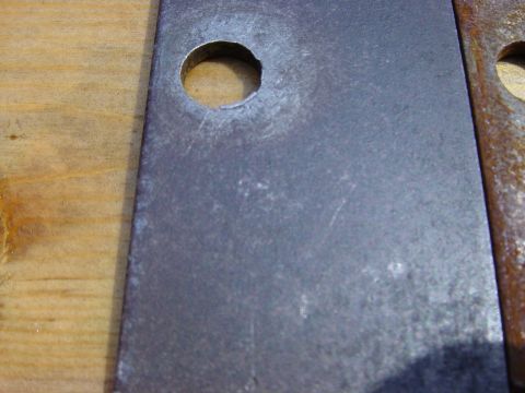 1988 Ford Bronco - Close-up of a metal plate with a hole, likely a replacement part.