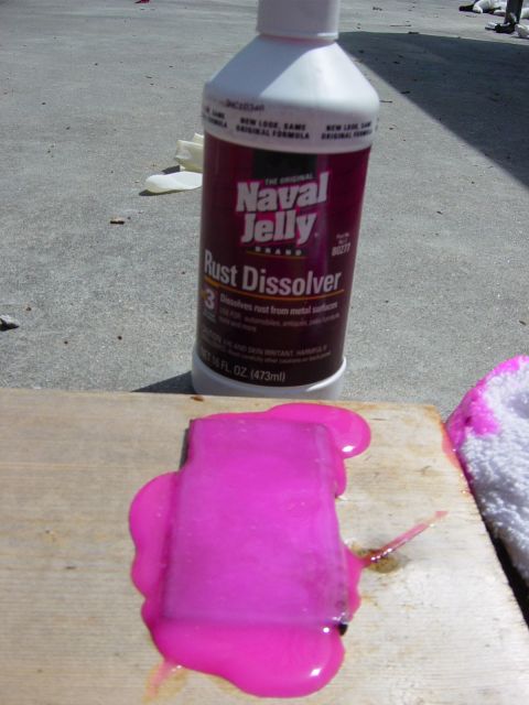 1988 Ford Bronco - A bottle of Naval Jelly Rust Dissolver is shown next to a piece of wood with the product applied.
