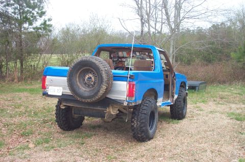 1987 Ford Bronco - This lifted Ford Bronco, viewed from the rear, appears to be from the early 1980s, not 1987.