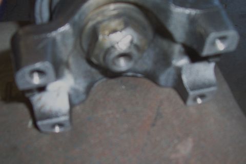 1994 Ford F-150 - Close-up view of a driveshaft U-joint, a critical component for power transmission.