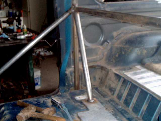 Door brace welded to main hoop