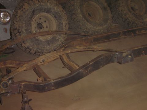 1992 Ford Bronco - The frame and tires of a vehicle are visible in this image.
