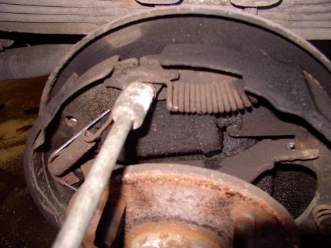 1986 Ford Bronco - Using a brake tool, flip the springs off. The new looking tension cable on the left is another great thing to keep at least one spare of in…