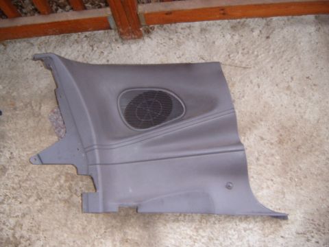 1993 Ford Probe - Gray interior door panel with integrated speaker grille, likely from a car's door.