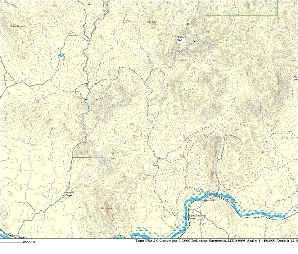 Topographic map with contour lines, labeled buttes, mine, and a river