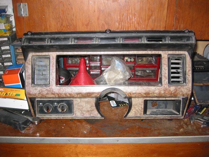 Original guage panel. I didn't cut this one up, but this is what the one I used started out looking like(Minus the vents.)