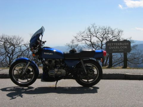 1985 Ford LTD Crown Victoria - A blue Suzuki motorcycle is parked at Fetterbush Overlook, elevation 3494 feet.