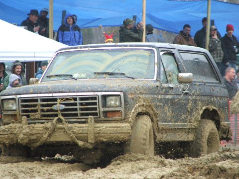 1996 Ford Bronco - This Ford Bronco is deep in the mud at an off-road event.