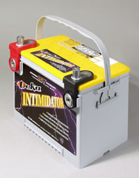 2000 Ford Taurus - A Delco Intimidator car battery is shown with its terminals and handle.