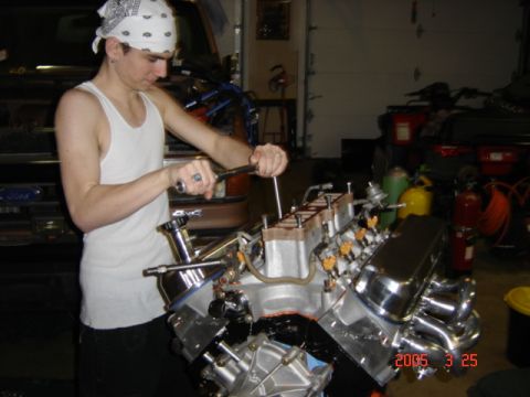 1990 Ford Bronco - My son torquing the intake manifold.