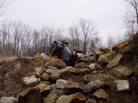 1992 Ford Bronco - An off-road vehicle has overturned while navigating a challenging rocky course.