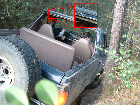 1993 Ford Bronco - This 1992 Ford Bronco is shown from a three-quarter front interior view while navigating an off-road trail.