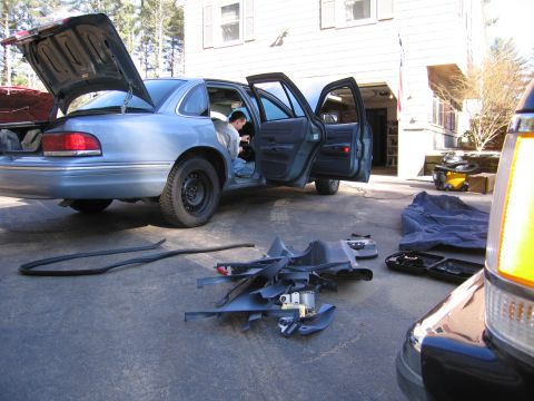 1991 Ford LTD Crown Victoria - Interior parts removed from a 1991 Ford Crown Victoria LTD during work in the driveway.