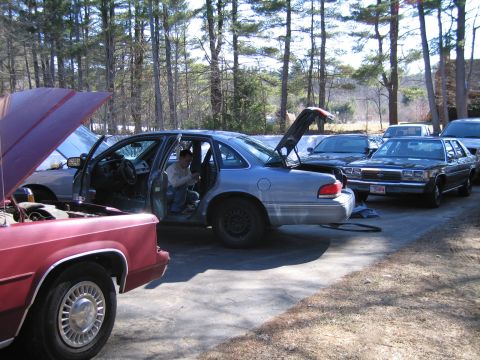 1991 Ford LTD Crown Victoria - A silver 1991 Ford Crown Victoria LTD is parked in a driveway with its doors and trunk open, while another car is visible in the background.
