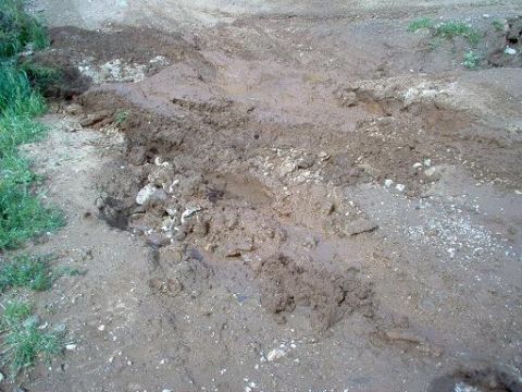 1988 Ford Bronco - The road is covered in mud and debris, making it difficult to traverse.