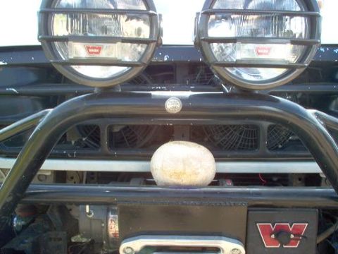 1988 Ford Bronco - Front view of a 1988 Ford Bronco equipped with Warn off-road lights and a winch.