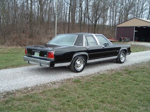 1989 Ford Crown Victoria LTD - Black 1989 Ford Crown Victoria LTD sits on a gravel driveway next to a barn.