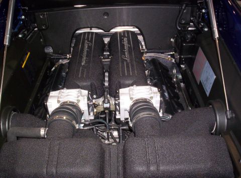 1989 Ford Bronco - Close-up view of a Lamborghini V10 engine, showing the intake system and engine covers.