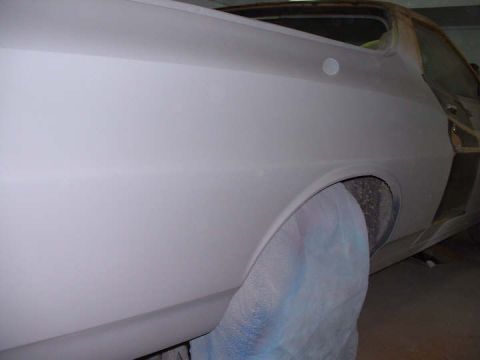 1972 Ford Ranchero - Side view of a 1972 Ford Ranchero undergoing bodywork, with primer applied.