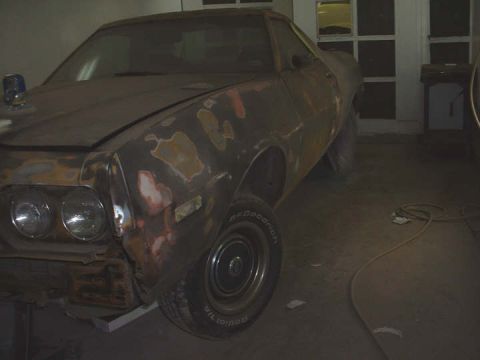1972 Ford Ranchero - This 1972 Ford Ranchero is in a garage, appearing to be in the process of restoration with body repairs.