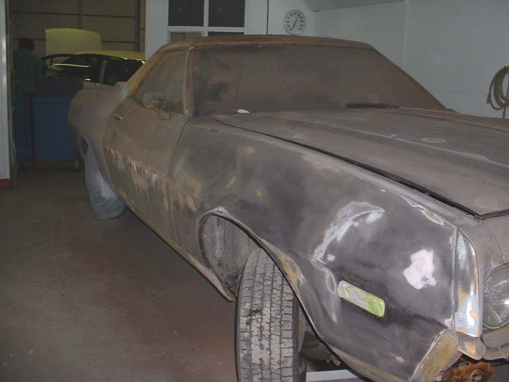 1972 Ford Ranchero bodywork in a garage, another car visible behind