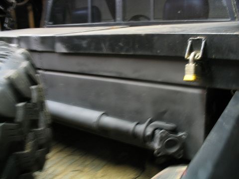 1986 Ford F-150 - A locked toolbox and driveshaft are visible on the side of a truck bed.