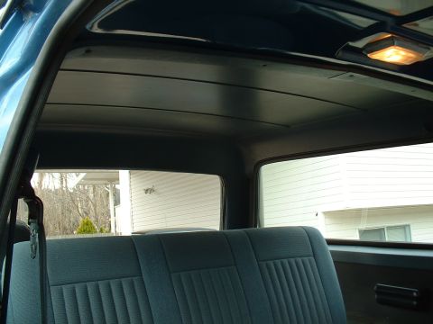 1990 Ford Bronco - Interior view of a 1990 Ford Bronco, focusing on the rear seat and headliner.