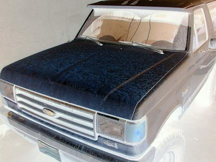 1988 Ford Bronco - Front view of a 1987 Ford Bronco, showing its grille and headlights.