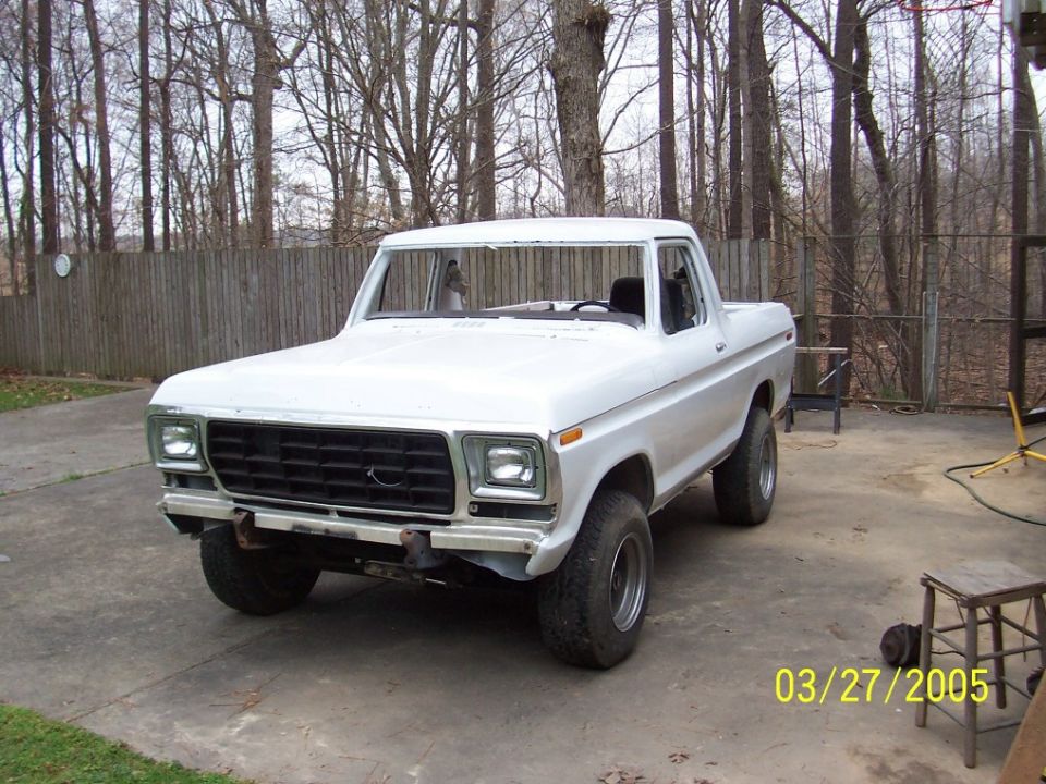 White 1979 Ford Bronco front 3/4 view, undergoing restoration