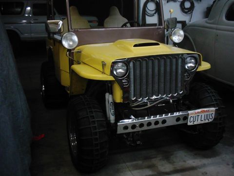 1978 Ford Bronco - This modified jeep features a prominent chrome grille and a custom front bumper with a California license plate.