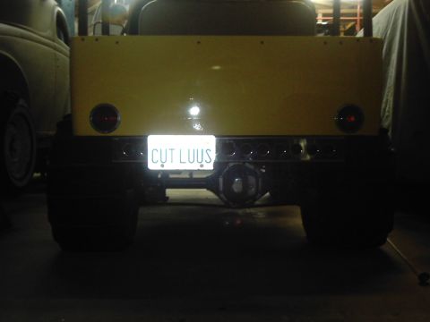 1978 Ford Bronco - This off-road vehicle has a custom yellow bed and a "CUT LUUS" license plate.