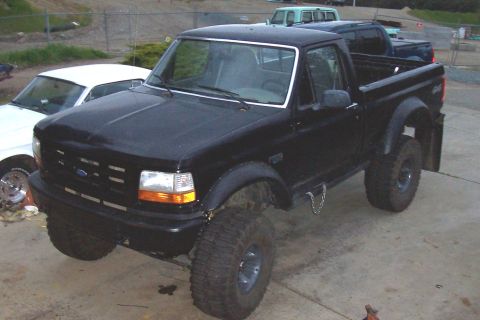 1986 Ford Bronco - This black Ford F-150 pickup truck appears to be from the early to mid-1990s.