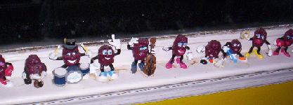 1971 Ford Mustang - A collection of raisin figures, some playing instruments and drums, are displayed on a windowsill.