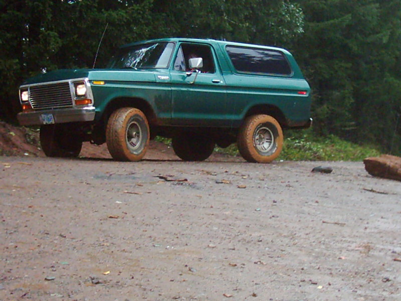 Green 1978 Ford Bronco on a dirt road