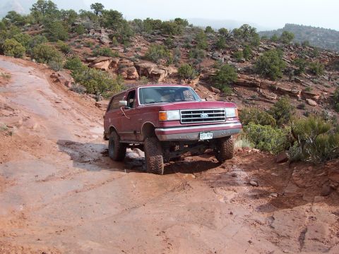 1991 Ford Bronco - This 1991 Ford Bronco tackles a challenging muddy trail during an off-road excursion.